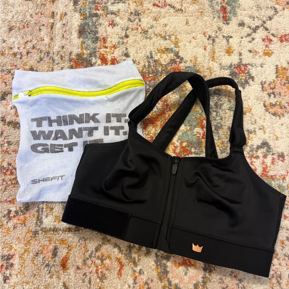SHEFIT Black Zip Front Sports Bra with Mesh Bag
